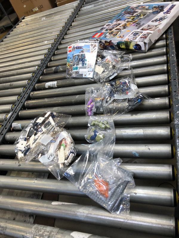 Photo 3 of LEGO Marvel Avengers Compound Battle 76131 Building Set Includes Toy Car, Helicopter, and Popular Avengers Characters Iron Man, Thanos and More (699 Pieces) - Missing Pieces, Remaining Bags Are Sealed. Box Packaging Damaged.
