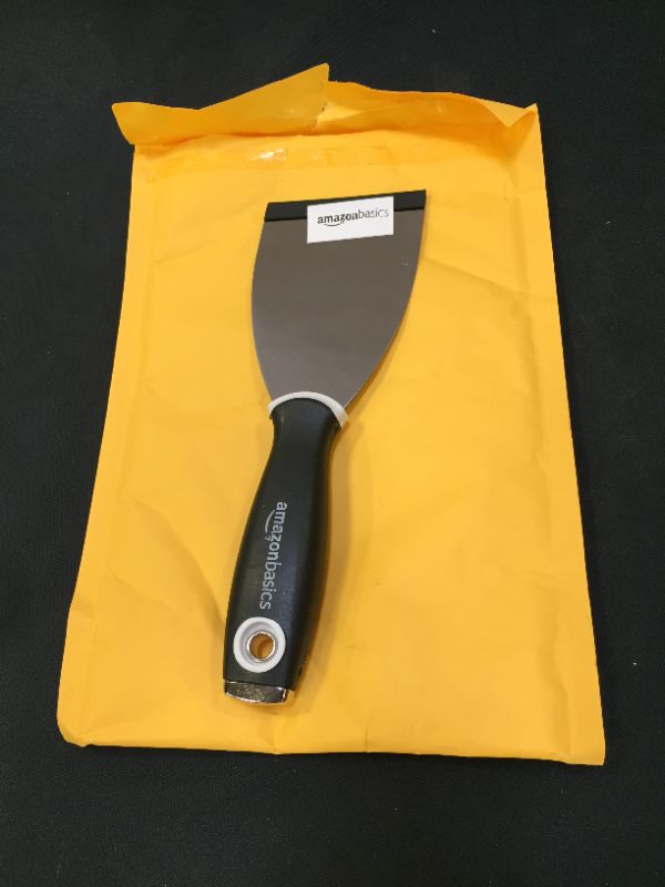 Photo 2 of Amazon Basics 3" Flexible, Soft Grip, Carbon Steel Putty Knife with Hammer End
