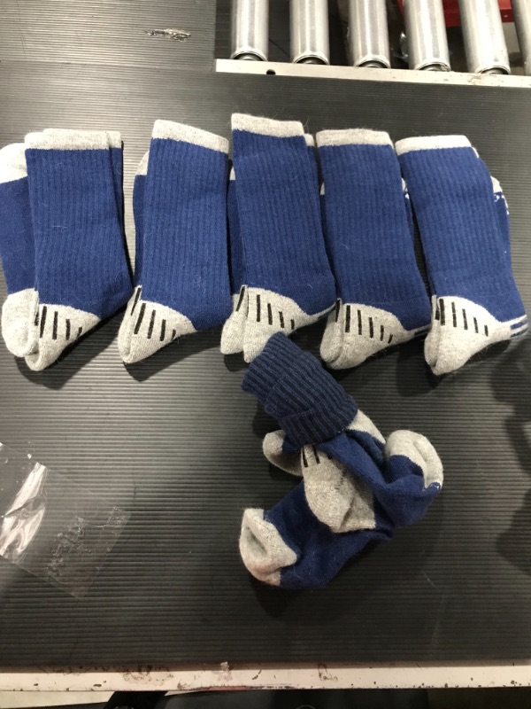 Photo 1 of 6 pairs of long blue socks 