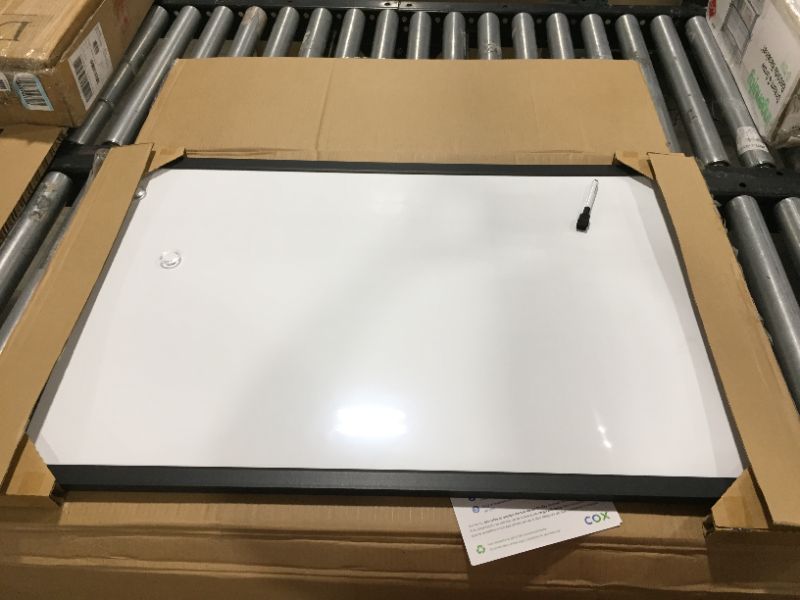 Photo 1 of Amazon Basics Magnetic Dry Erase White Board, 35 x 23-Inch Whiteboard - Black Wooden Frame
