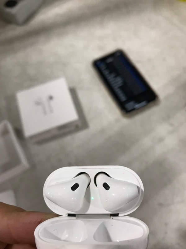 Photo 2 of Apple AirPods (2nd Generation) Wireless Earbuds with Lightning Charging Case Included. Over 24 Hours of Battery Life, Effortless Setup. Bluetooth Headphones for iPhone
