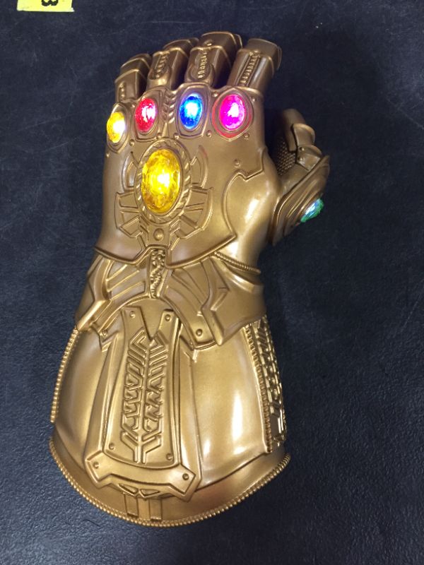 Photo 2 of  Adult Infinity Gauntlet LED Light-up Thanos Glove PVC Wearable Halloween Thanos Electronic Fist Cosplay Props Toy with Batteries