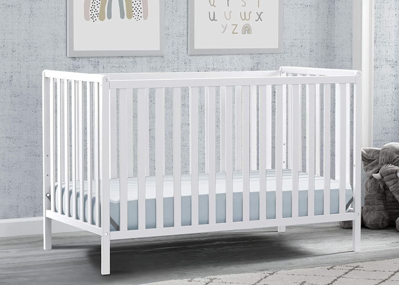 Photo 1 of Delta Children Heartland 4-in-1 Convertible Crib, Bianca White + Delta Children Twinkle Galaxy Dual Sided Recycled Fiber Core Crib