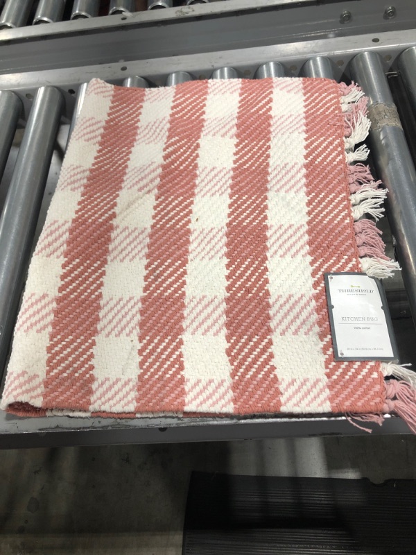 Photo 1 of 20" x 34" pink and white stripped kitchen rug 
