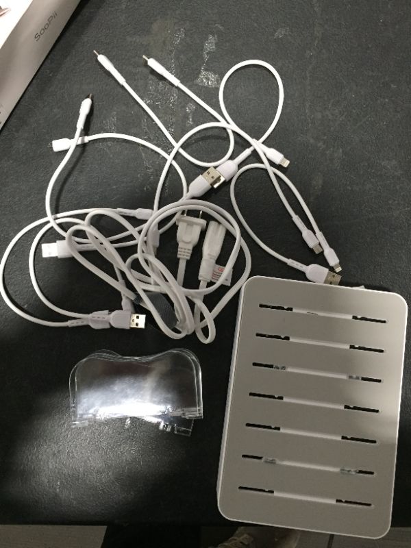 Photo 2 of SooPii 60W 6-Port Charging Station for Multiple Devices, PD 20W USB C Fast Charging for lPhone 14/13/12,6 Short Cables Included 
CLEAR PLASTIC PIECES ARE CHIPPED 
SOME WIRES ARE MISSING PARTS 