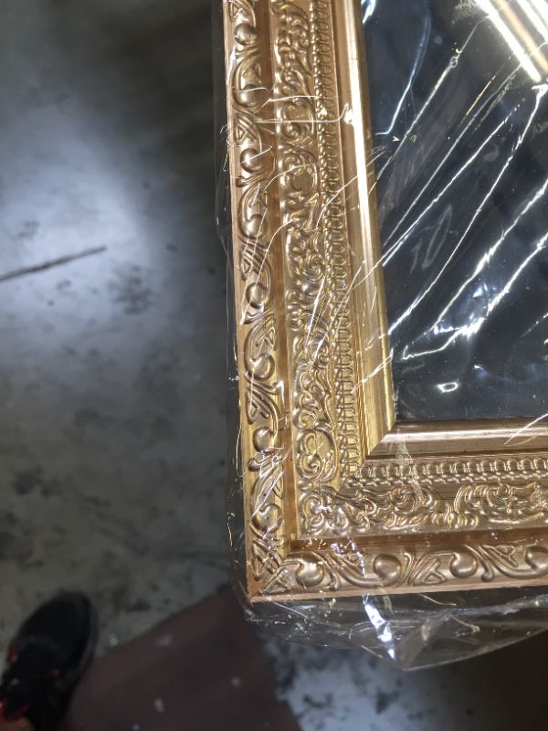 Photo 1 of 12"X42" WALL MIRROR WITH GOLD FRAME WORK
