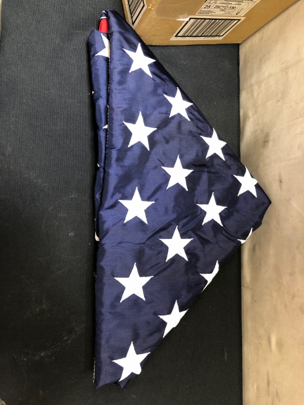 Photo 2 of "FOLDED" AMERICAN FLAGS, UNKNOWN SIZE/MATERIAL.