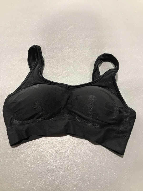 Photo 1 of Black sports bra, size M.