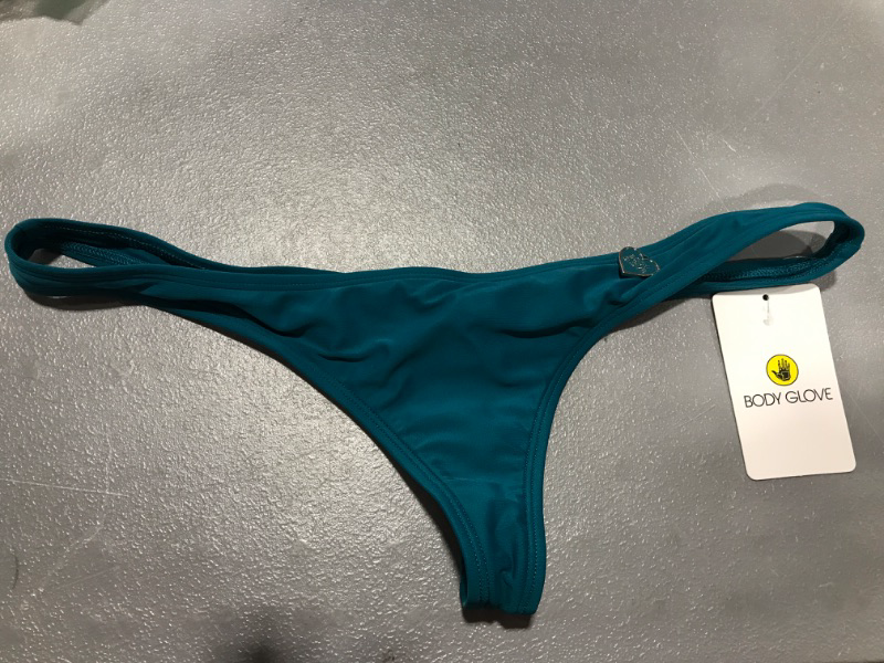 Photo 1 of blue thong with a charm, size M.