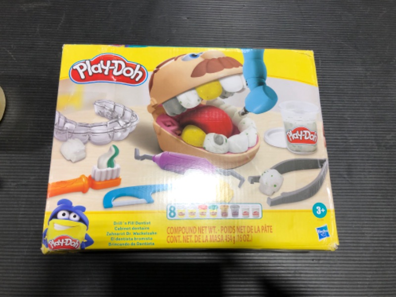 Photo 2 of Play-Doh Drill 'n Fill Dentist Toy for Kids 3 Years and Up with Cavity and Metallic Colored Modeling Compound, 10 Tools, 8 Total Cans, 2 Ounces Each, Non-Toxic, Assorted Colors single---MINOR BOX DAMAGE USED TAPE TO SEAL CORRECTLY 