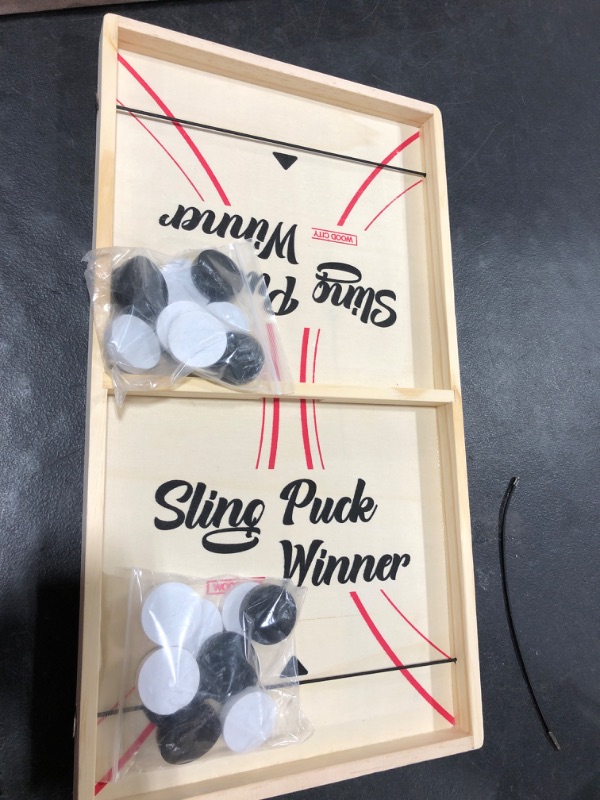 Photo 1 of Fast Puck Game, Sling Games Fast Puck Table Game Paced Puck Winner Wood Board Sport Toys (Small Size Suitable for Kids Child & Family), Come with Spare Piece and Spring Rope 