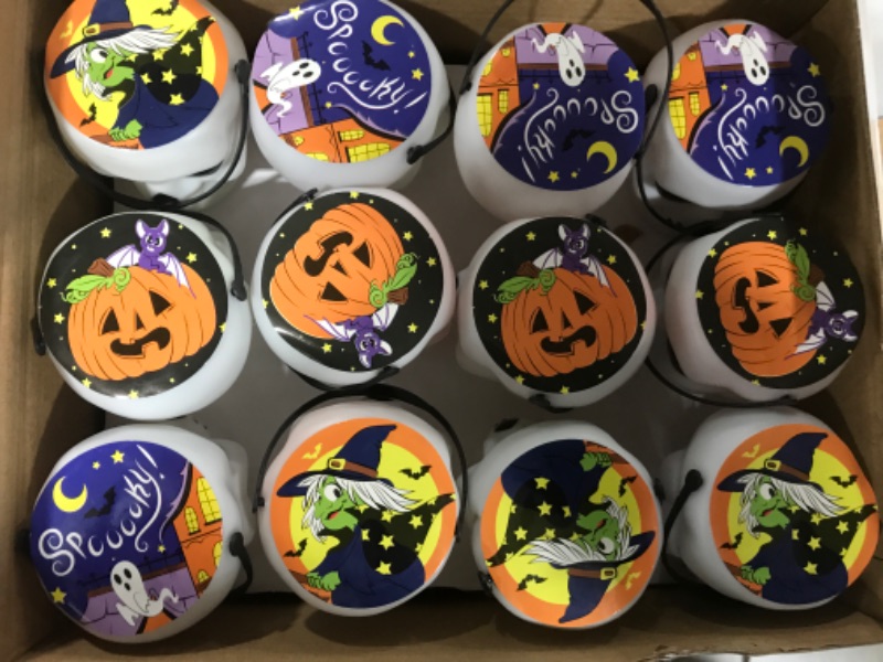 Photo 2 of Halloween Party Favors Set, 24 Pack Prefilled Skull Bucket with Halloween Themed Party Favors Including Halloween Stamps, Bouncy balls, Eyeballs, Vampire teeth, Tops, Spiders, Spider Webs, Slap Bracelets and Pumpkins for Kids Trick or Treat, Party Favors,