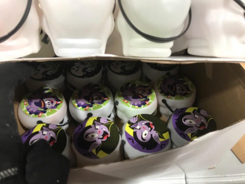 Photo 3 of Halloween Party Favors Set, 24 Pack Prefilled Skull Bucket with Halloween Themed Party Favors Including Halloween Stamps, Bouncy balls, Eyeballs, Vampire teeth, Tops, Spiders, Spider Webs, Slap Bracelets and Pumpkins for Kids Trick or Treat, Party Favors,