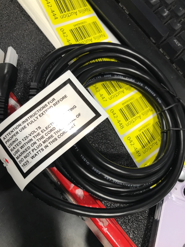 Photo 1 of Black extension cord 