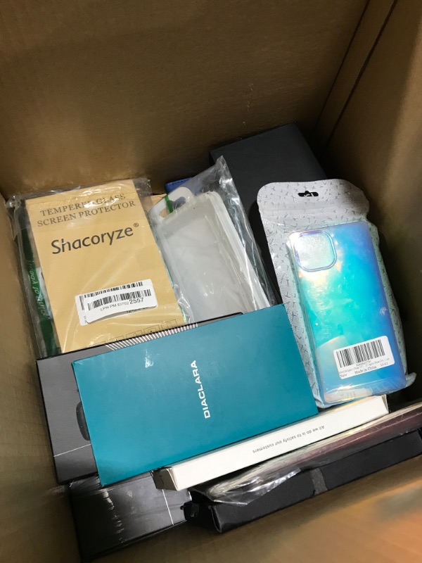 Photo 2 of Small box lot of phone cases and tablet case. New and used, various styles, sold as is.