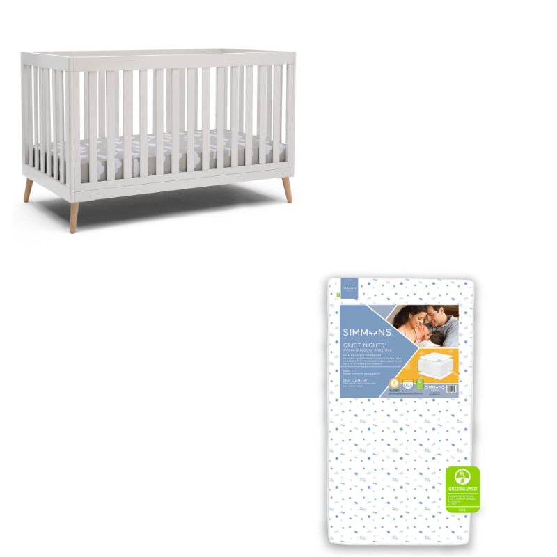 Photo 1 of Delta Children Essex 4-in-1 Convertible Baby Crib, Bianca White with Natural Legs + Simmons Kids Quiet Nights Dual Sided Crib and Toddler Mattress (Bundle)