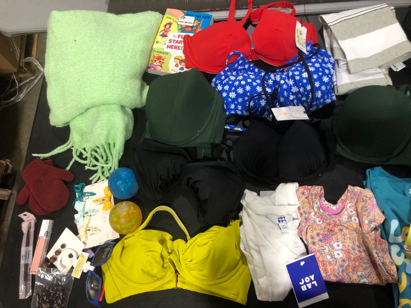 Photo 2 of BAG LOT!! CLOTHING & ACCESSORIES -- VARIETY OF NEW MISC ITEMS -- MISSING PCS. -- LOTS OF BIKINI TOPS -- SIZES VARY 