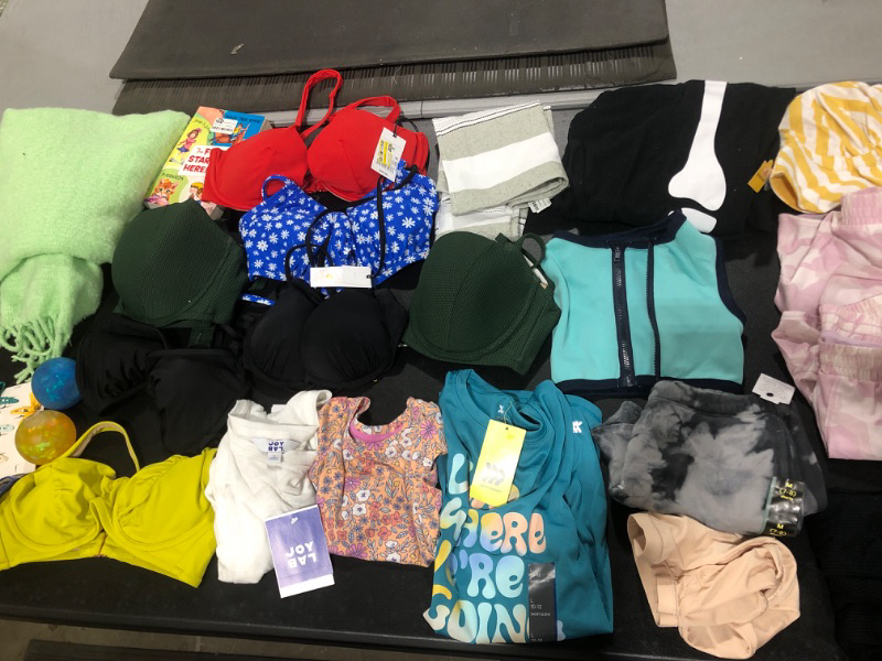 Photo 1 of BAG LOT!! CLOTHING & ACCESSORIES -- VARIETY OF NEW MISC ITEMS -- MISSING PCS. -- LOTS OF BIKINI TOPS -- SIZES VARY 