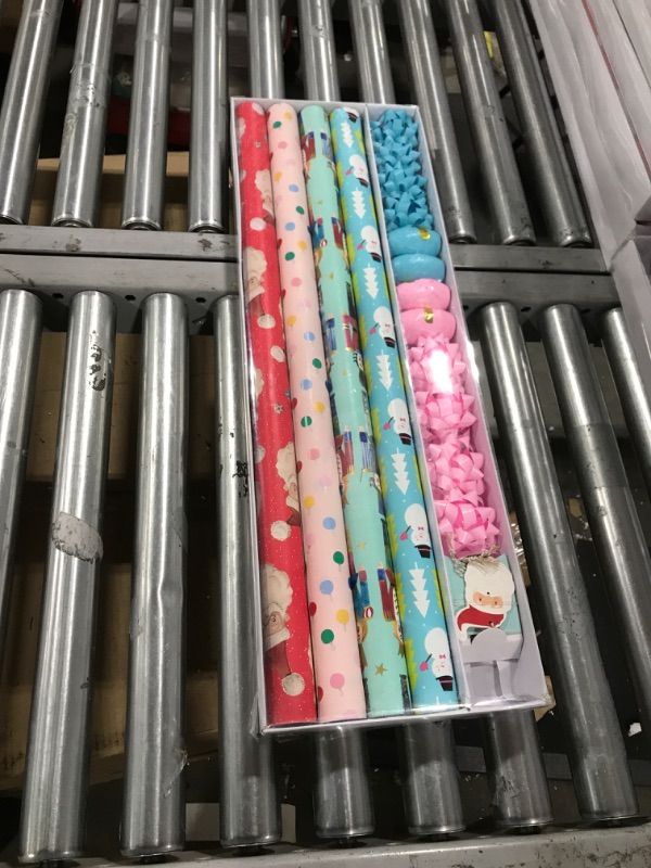 Photo 2 of Wrapping Paper, Christmas Wrapping Paper for Kids Boys, Girls, baby. 4 Cute Designs Including Santa, Christmas Lights, Snowman, Nutcracker. Includes Decorative Flowers, Ribbons, Labels. Each Roll of Gift Wrap Paper Measures 27.5 In X 13 ft