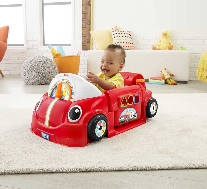 Photo 1 of Fisher-Price Laugh & Learn Crawl Around Car, red interactive play center with Smart Stages learning content for babies and toddlers ages 6 months and up
