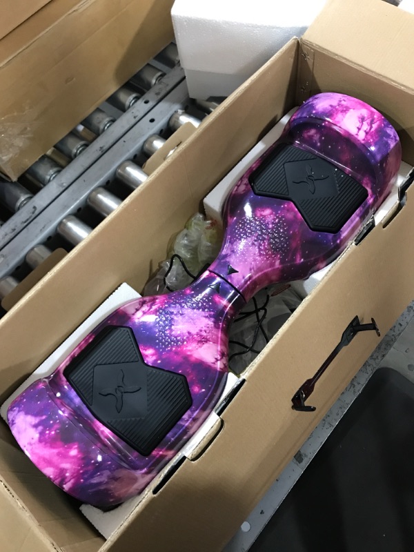 Photo 2 of Hover-1 Helix Electric Hoverboard | 7MPH Top Speed, 4 Mile Range, 6HR Full-Charge, Built-in Bluetooth Speaker, Rider Modes: Beginner to Expert Hoverboard Galaxy