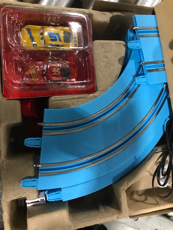 Photo 2 of Carrera First Disney/Pixar Cars - Slot Car Race Track - Includes 2 Cars: Lightning McQueen and Dinoco Cruz - Battery-Powered Beginner Racing Set for Kids Ages 3 Years and Up Disney Cars w/ Spinners