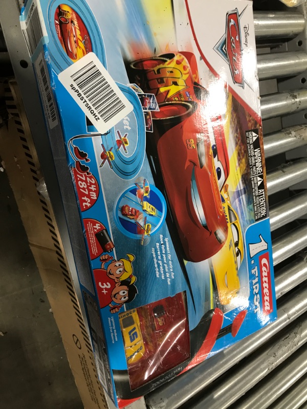 Photo 3 of Carrera First Disney/Pixar Cars - Slot Car Race Track - Includes 2 Cars: Lightning McQueen and Dinoco Cruz - Battery-Powered Beginner Racing Set for Kids Ages 3 Years and Up Disney Cars w/ Spinners