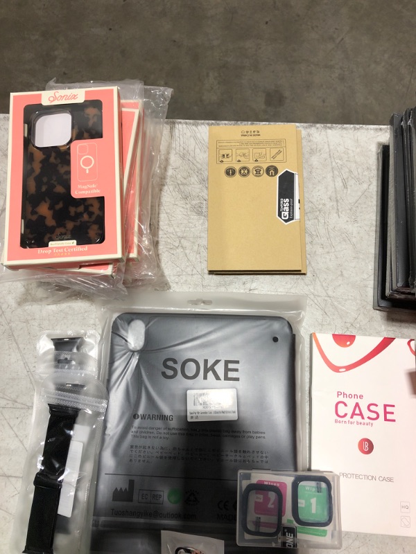 Photo 3 of Large box lot of phone cases, smart watch bands, tablet cases, screen protectors, etc. All brand new. Various styles and compatibilities. Sold as is.