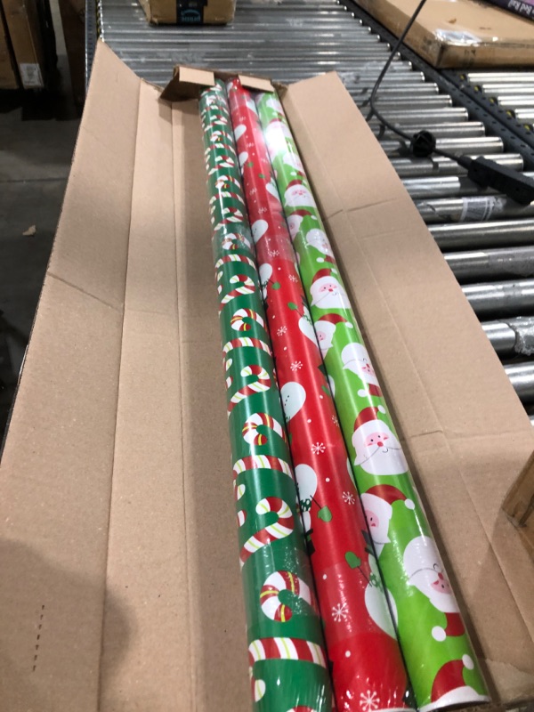Photo 2 of American Greetings Reversible Christmas Extra-Wide Wrapping Paper Bundle, Santa, Snowmen and Candy Canes (3 Rolls, 120 sq. ft.)
