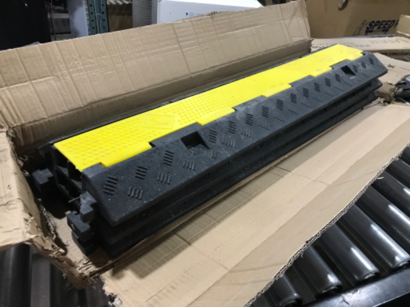 Photo 2 of damge - missing parts - used CXRCY Cable Ramp 3 Pack 2 Channel 11000lbs axle Capacity Floor Cord Cable Protector, Black & Yellow Speed Bumps Hose Protector Ramps for Wire/Hose/Pipe Hider Driveway &Outdoor 40x10x2 inch(L x W x H)