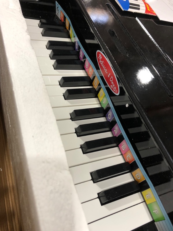 Photo 2 of Melissa & Doug Learn-To-Play Classic Grand Piano With 30 Keys, Color-Coded Songbook, and Non-Tip Bench