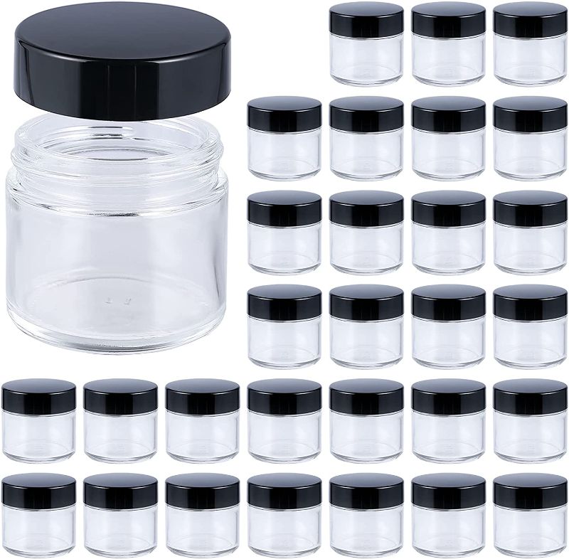 Photo 1 of 2oz Jars with Lids, HOA Kinh 30 Pack Clear Glass Jars with Lids Empty Cosmetic Containers Round Airtight Glass Jar with Black Lids for Storing Lotions Powders Ointments
