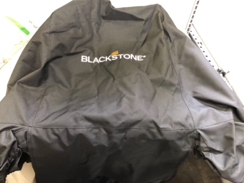 Photo 1 of BLACKSTONE Grill Cover, BBQ Grill Cover, Waterproof, Weather Resistant, Rip-Proof, Anti-UV, Fade Resistant 
---UNKOWN SIZE, MORE ON THE SMALL SIDE ---