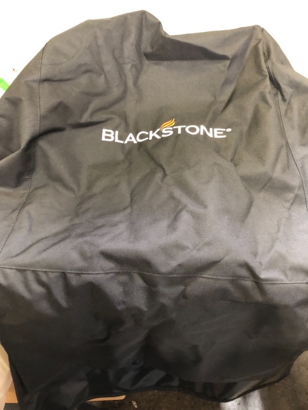 Photo 2 of BLACKSTONE Grill Cover, BBQ Grill Cover, Waterproof, Weather Resistant, Rip-Proof, Anti-UV, Fade Resistant 
---UNKOWN SIZE, MORE ON THE SMALL SIDE ---