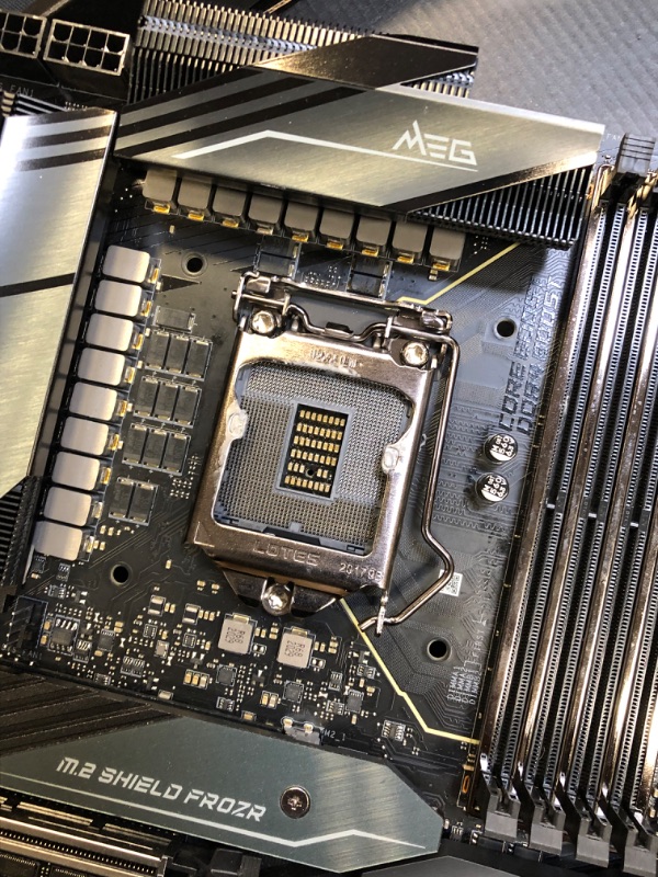 Photo 8 of MSI MEG Z490 GODLIKE Gaming Motherboard (E-ATX, 10th Gen Intel Core, LGA 1200 Socket, DDR4, SLI/CF, Triple M.2 Slots, Thunderbolt 3 Type-C, Wi-Fi 6, Mystic Light RGB) DAMAGED PIN BOTTOM RIGHT/ DAMAGED / DAMAGED / DAMAGED / DAMAGED / USED FOR PARTS ONLY 

