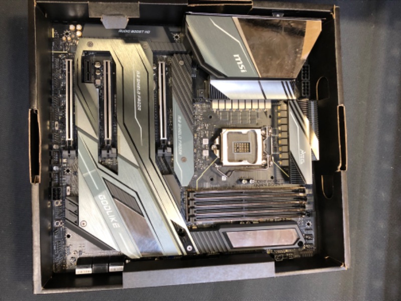 Photo 6 of MSI MEG Z490 GODLIKE Gaming Motherboard (E-ATX, 10th Gen Intel Core, LGA 1200 Socket, DDR4, SLI/CF, Triple M.2 Slots, Thunderbolt 3 Type-C, Wi-Fi 6, Mystic Light RGB) DAMAGED PIN BOTTOM RIGHT/ DAMAGED / DAMAGED / DAMAGED / DAMAGED / USED FOR PARTS ONLY 

