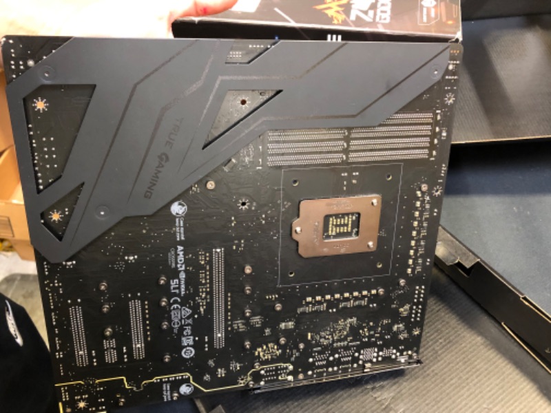 Photo 9 of MSI MEG Z490 GODLIKE Gaming Motherboard (E-ATX, 10th Gen Intel Core, LGA 1200 Socket, DDR4, SLI/CF, Triple M.2 Slots, Thunderbolt 3 Type-C, Wi-Fi 6, Mystic Light RGB) DAMAGED PIN BOTTOM RIGHT/ DAMAGED / DAMAGED / DAMAGED / DAMAGED / USED FOR PARTS ONLY 

