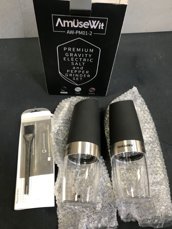 Photo 1 of Gravity Electric Salt and Pepper Grinder Set of 2 - Battery Operated Automatic Salt and Pepper Mills with White Light -- COULD NOT FULLY TEST