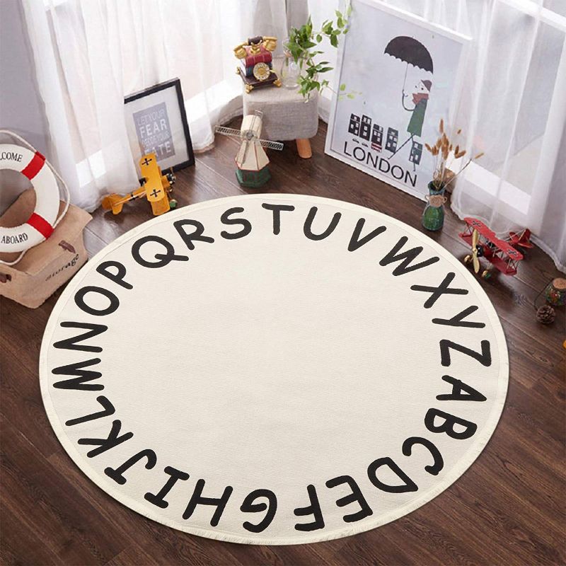 Photo 1 of ABC Kids Round Rug,4ft Cream Alphabet Cotton Baby Play Mat with Tassels Soft Educational Washable Carpet Nursery Teepee Tent Play Mat for Toddler Room Bedroom Living Room
