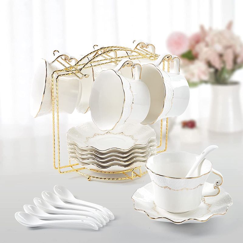 Photo 1 of DUJUST Tea Cups and Saucers Set of 6 (8.5 OZ), Luxury Tea Cup Set with Golden Trim, Relief Printing Coffee Cups with Metal Stand, British Royal Porcelain Tea Party Set - White
