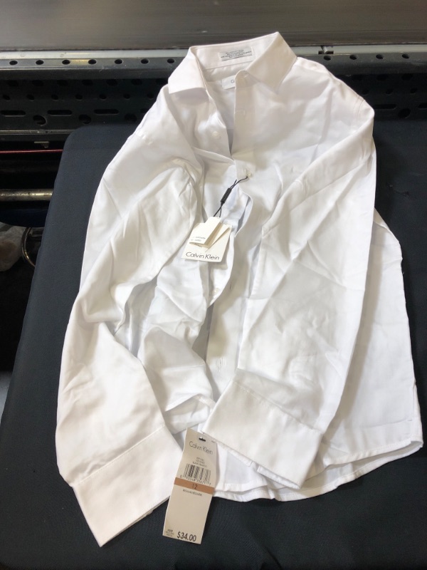 Photo 2 of Calvin Klein Boys' Long Sleeve Sateen Dress Shirt, Style with Buttoned Cuffs & Shirttail Hem
size - 12 