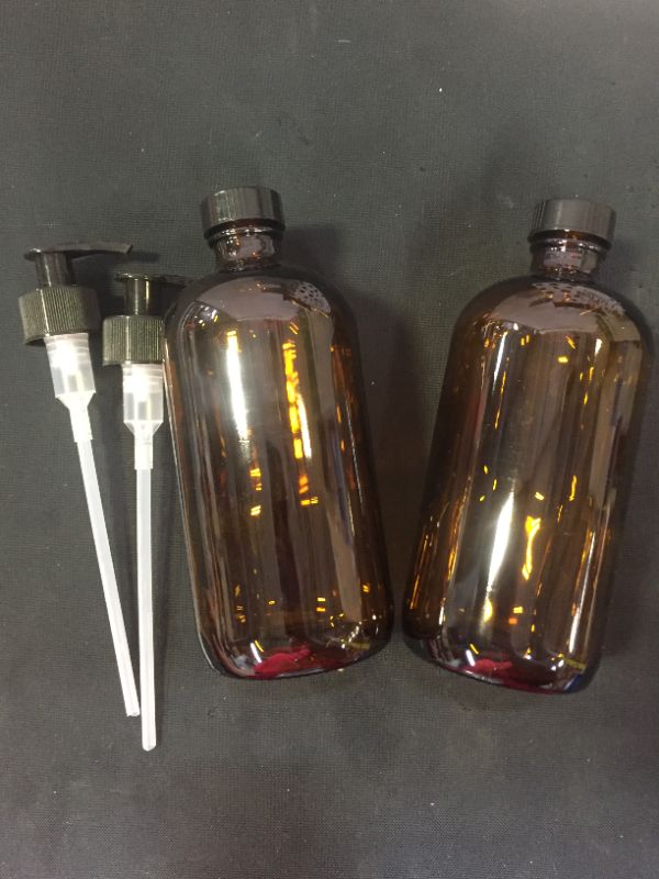 Photo 1 of 2 PCS AMBER BOTTLE WITH PUMP - SIZE UNKNOWN