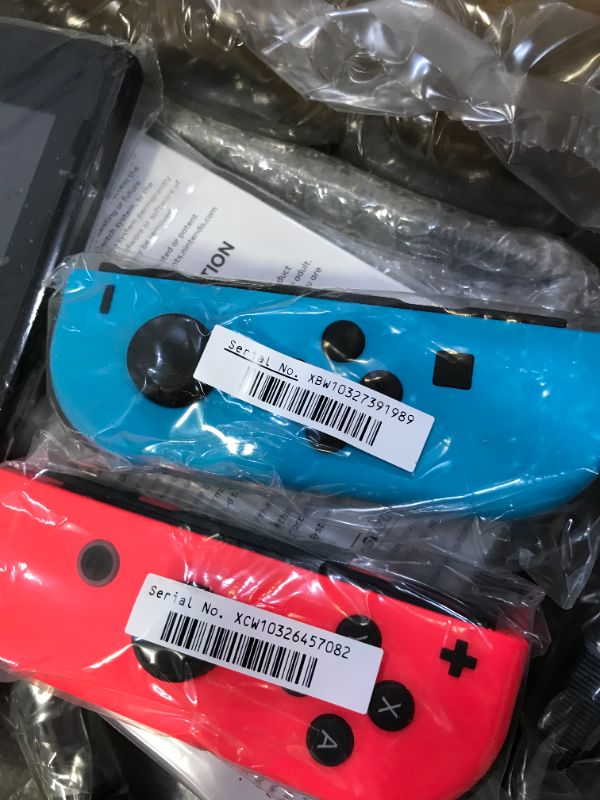 Photo 1 of Nintendo Switch with Neon Blue and Neon Red Joy Con --- RENEWED 
