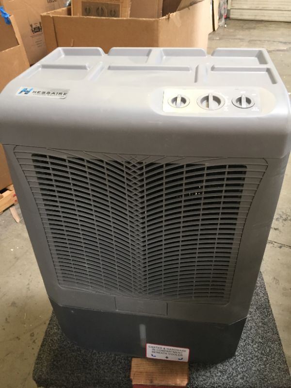 Photo 2 of Hessaire MC37M Evaporative Cooler, 3,100 CFM, Gray,No Box Packaging, Moderate Use, Scratches and Scuffs on item. Plastic Casing Opening Up Near Bottom as Shown in Pictures. Turn on and Blows Airs, Hardware Underneath Item
