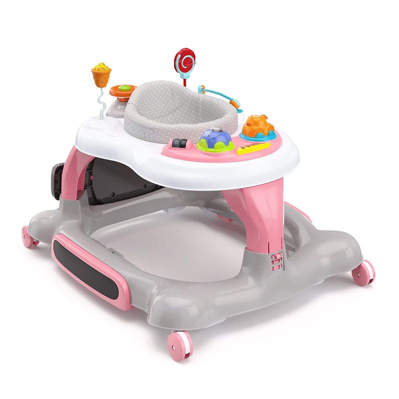 Photo 1 of Storkcraft 3-in-1 Activity Walker and Rocker with Jumping Board and Feeding Tray, Interactive Walker with Toy Tray and Jumping Board for Toddlers and Infants, Pink, Box Packaging Damaged, Moderate Use, Scratches and Scuffs on item. 
