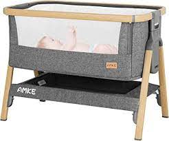 Photo 1 of AMKE Baby Bassinets,Bedside Sleeper for Baby,35s Quick Assemble Baby Crib with Storage Basket,Portable Bassinets for Safe Co-Sleeping, Adjustable Baby Bed for Infant Newborn(Wood Grain), Box Packaging Damaged, Minor Use
