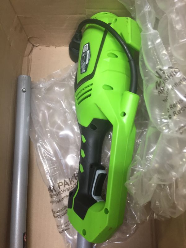 Photo 6 of Greenworks 18-Inch 10 Amp Corded String Trimmer (Attachment Capable) 21142, Box Packaging Damaged, Moderate Use, Scratches and Scuffs on item, Missing Parts, and Hardware, Selling for Parts.