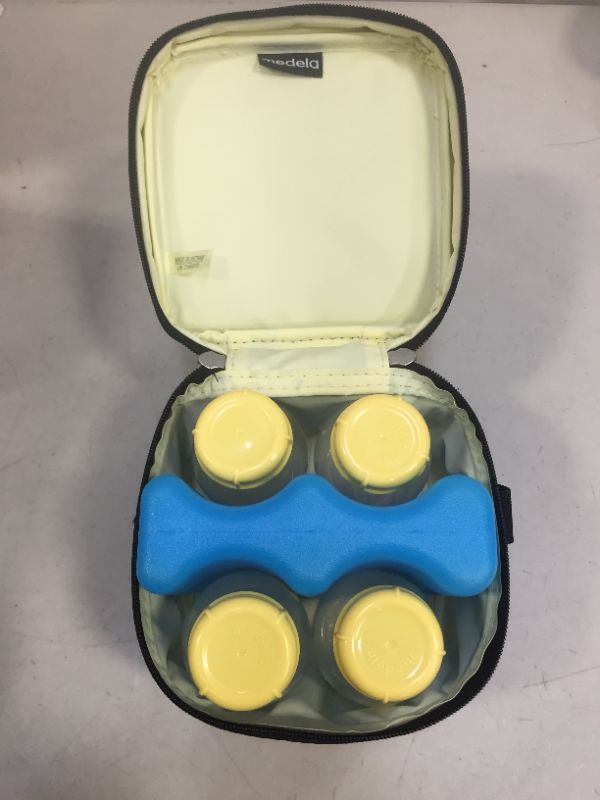 Photo 1 of Medela Breast Milk Cooler and Transport Set, 5 ounce Bottles with Lids, Contoured Ice Pack, Cooler Carrier Bag
