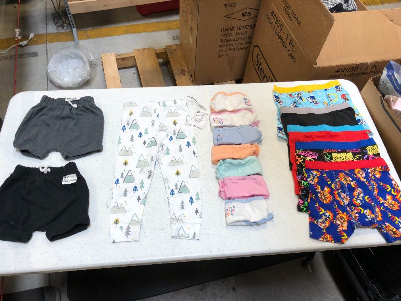 Photo 1 of Bag Lot Kids Clothing Items SIZES 8 in both the girls and boys underwear, 18 mo in pants, 3-6mo shorts