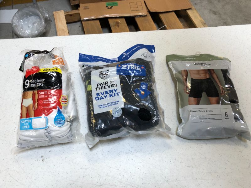 Photo 1 of Bag Lot 3 PACK MENS Clothing Items SIZES MEDIUM BRIEFS, SMALL BOXER BRIEFS,6-10 SOCKS